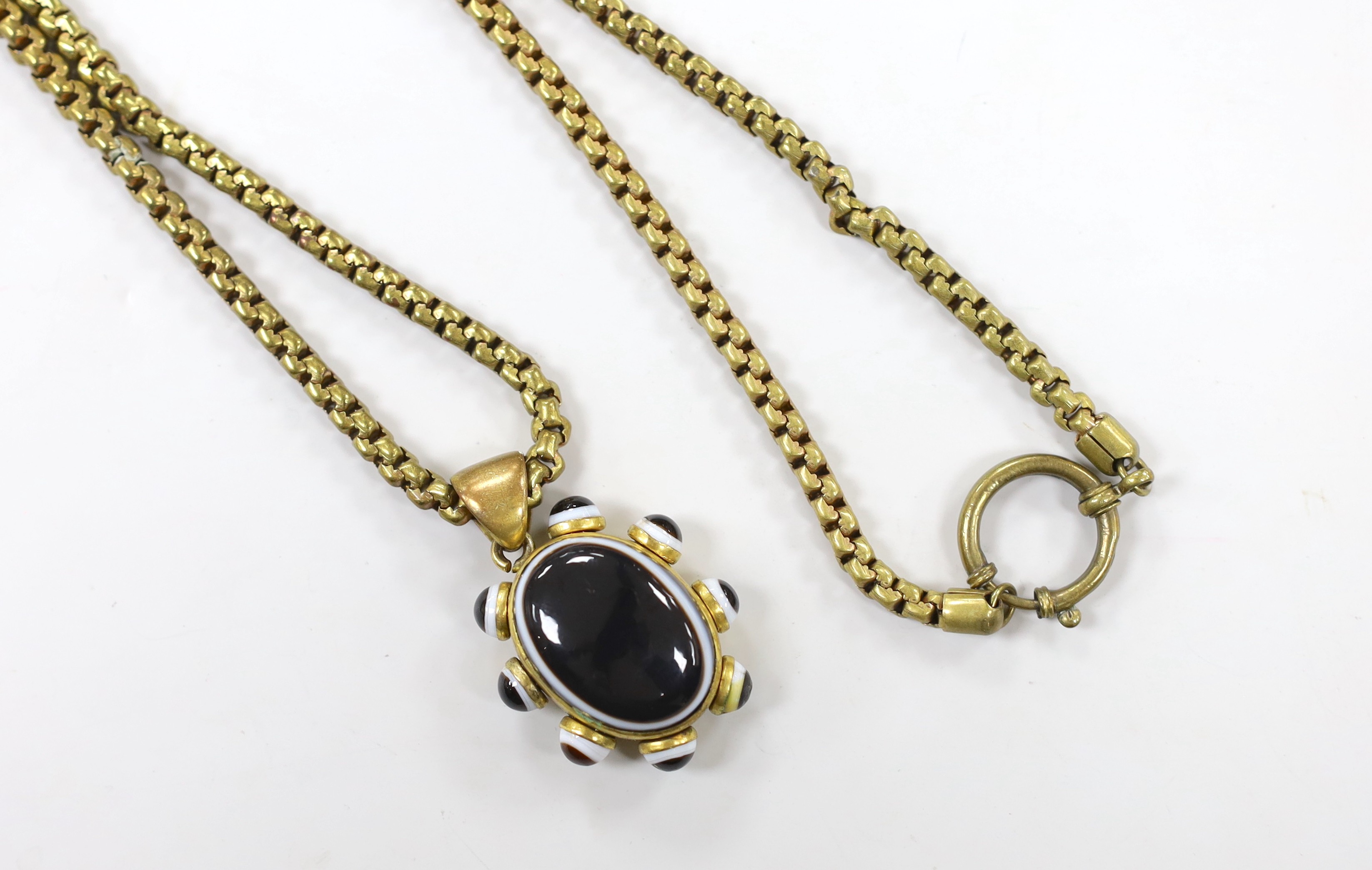 A Victorian pinchbeck and banded agate set pendant, 39mm, on a gilt metal chain.